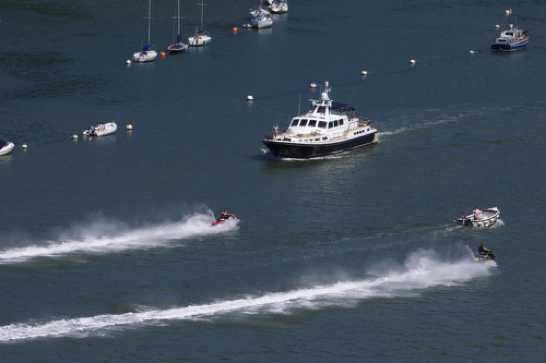 15 July 2021 - 15-06-14
The river Dart doesn't have many swimmers. But there are some. Hence the 6 knots or no wake speed limit. Clearly this does not apply to jet skiers. 
-------------------
Racing jet skiers in Dartmouth harbour